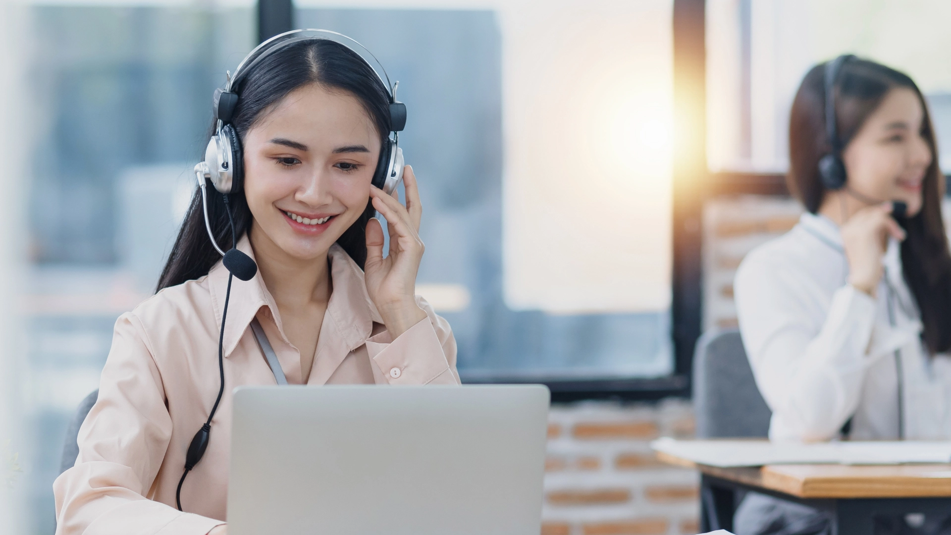 Professional customer service representative, wearing a headset, providing support and assistance.