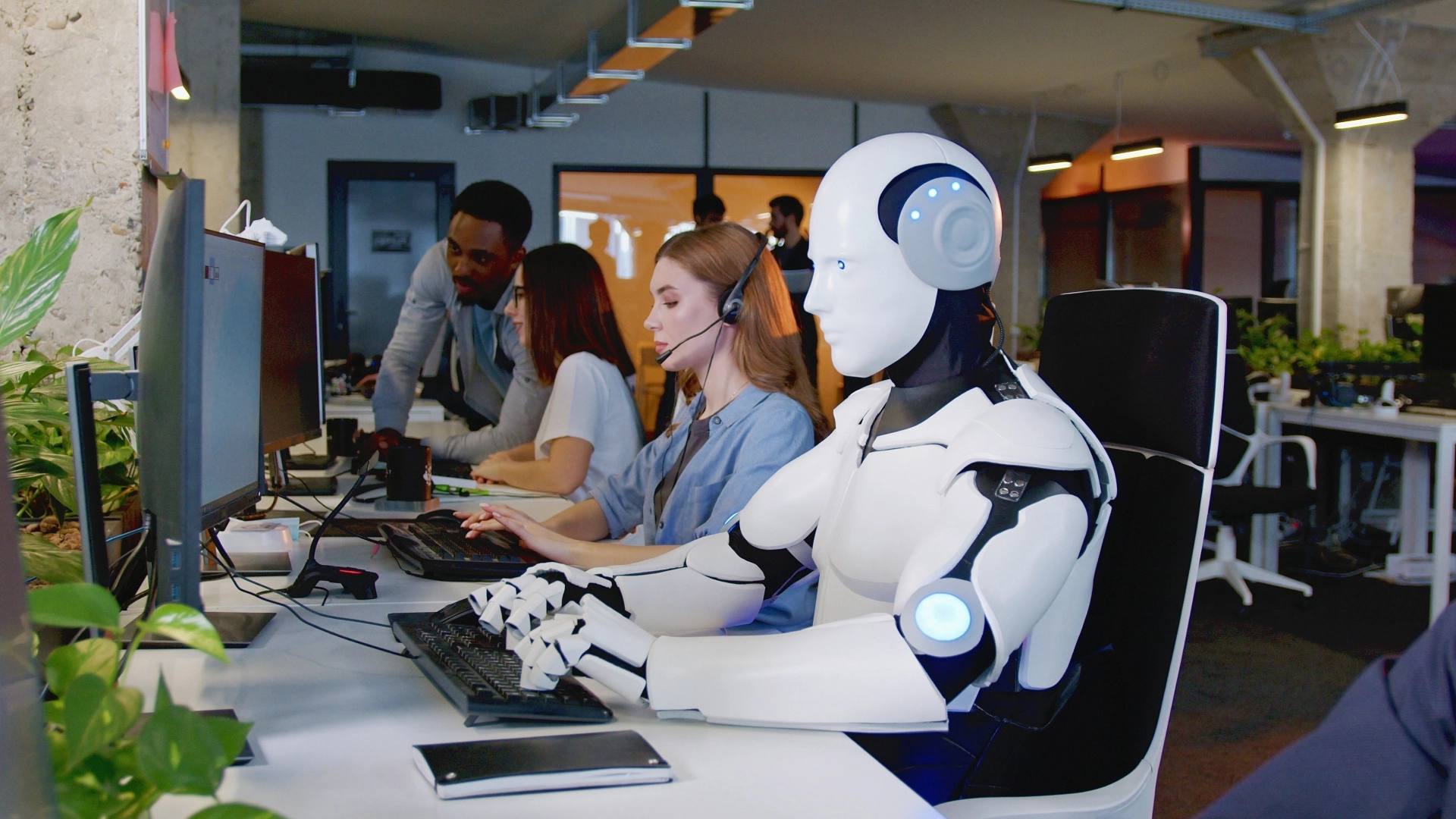 People and AI-powered robots working side by side in a call center.