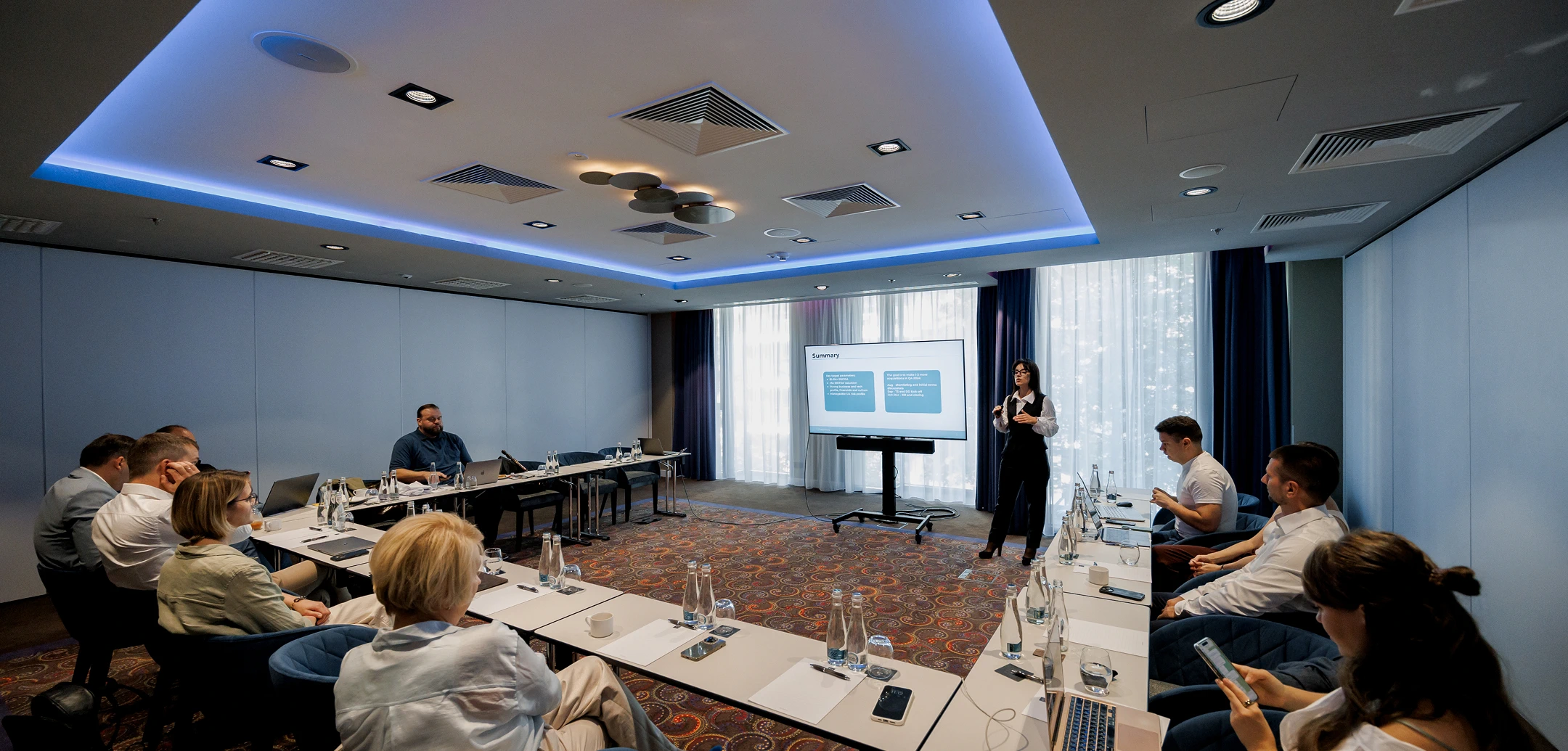Business meeting of Cognitime's leadership team in a spacious conference hall