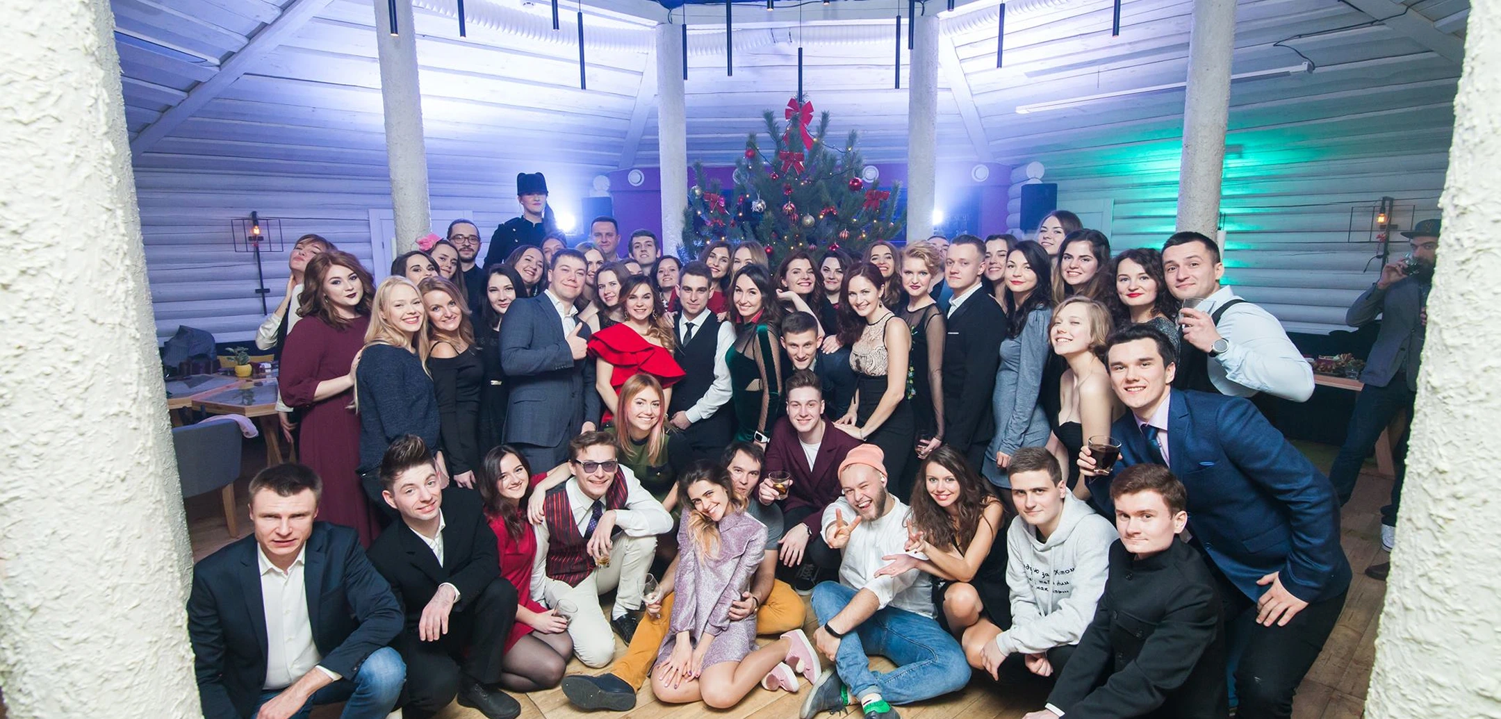 Group photo of Cognitime team members at a New Year's corporate party, celebrating together.