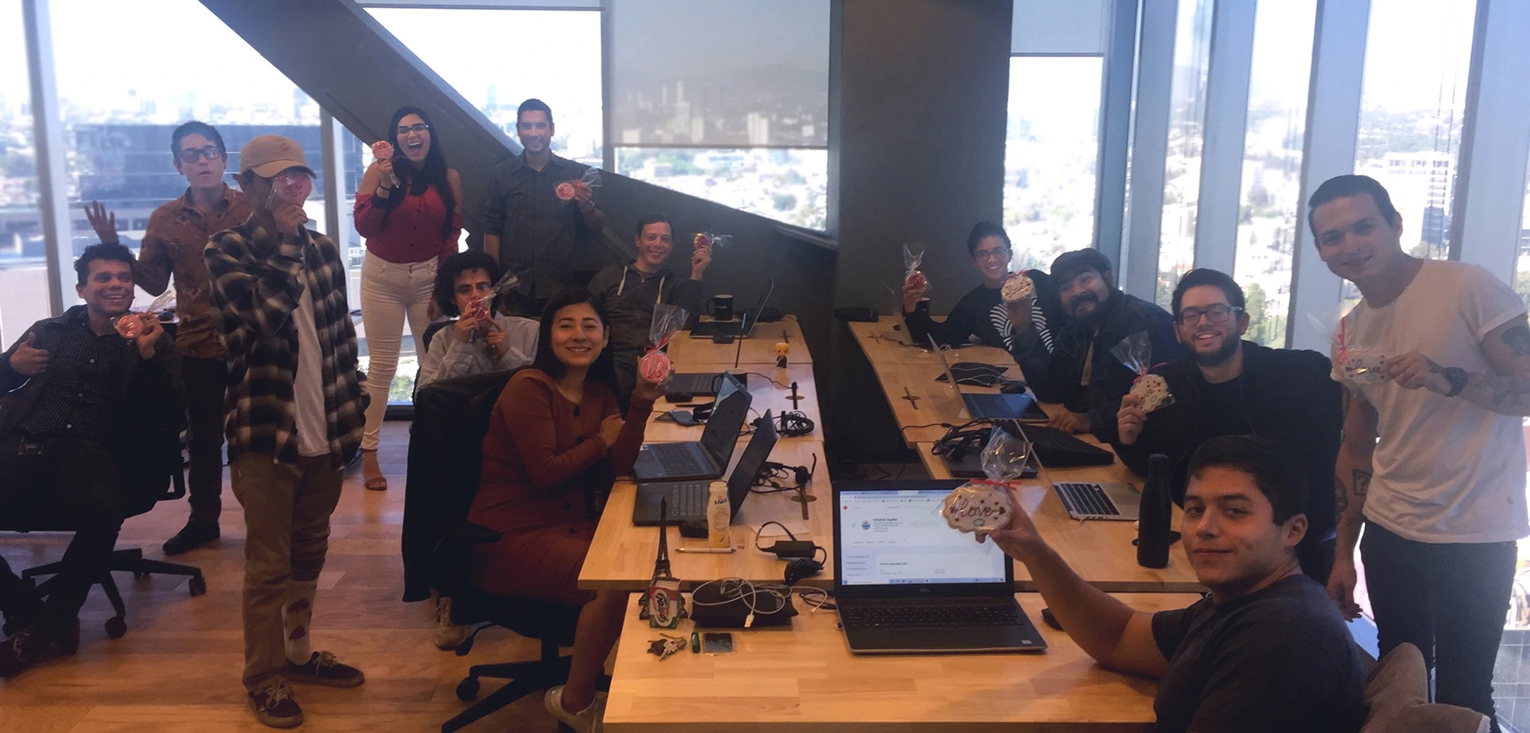 Group photo of Cognitime team members holding gifts.