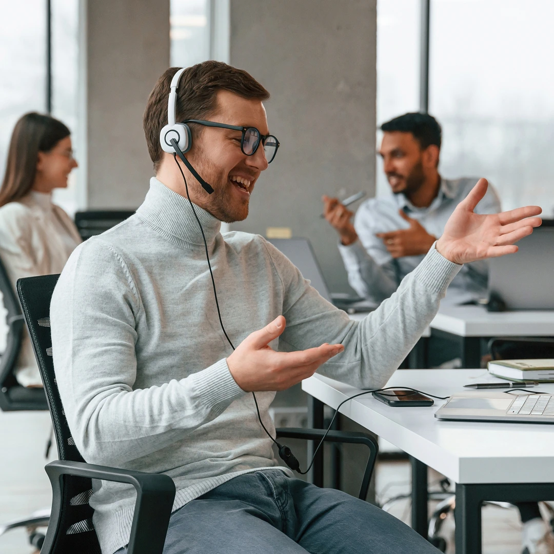 Friendly customer support agent helping a client in a call center in Ukraine