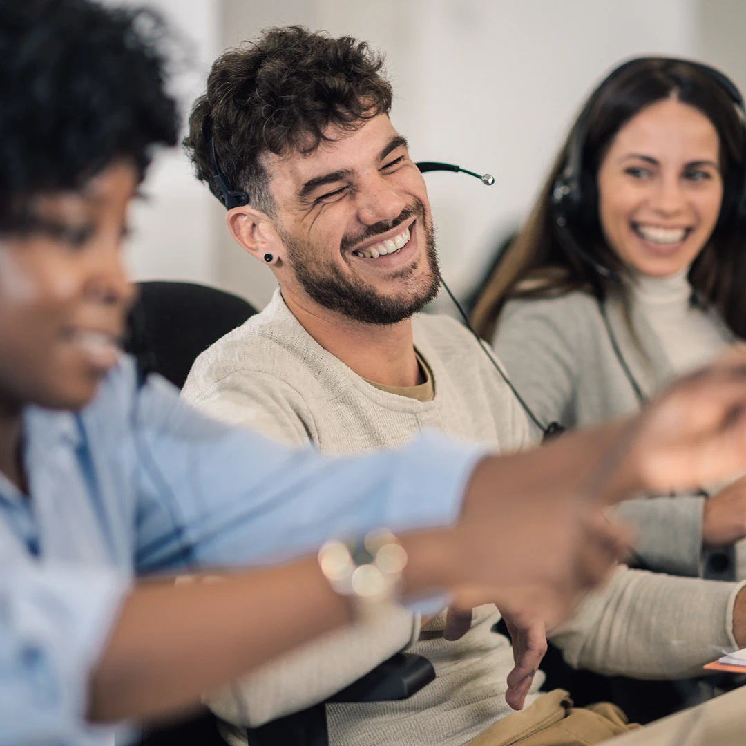 Сustomer service team laughing and enjoying their work