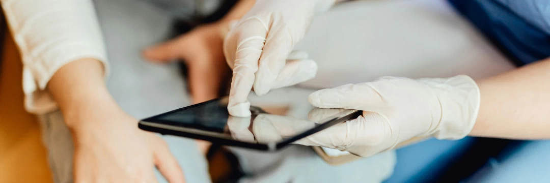 medical worker pointing at something on the screen