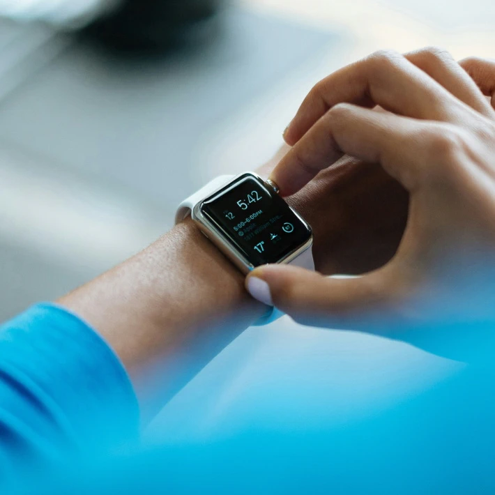 a female setting up her smartwatches