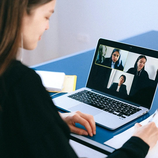 a woman in front of a laptop